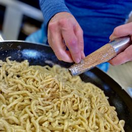 The boss herself gives our homemade spaetzle the finishing touch 👩